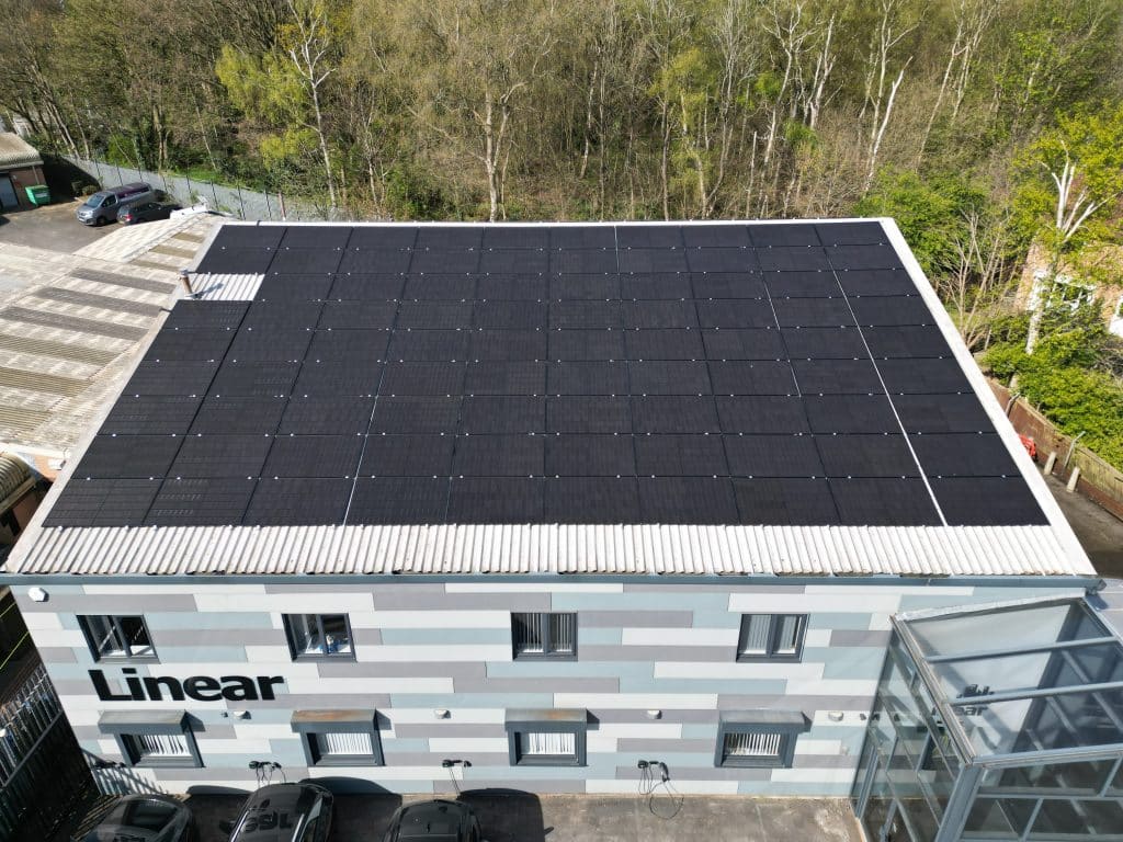 Commercial building with a full rooftop solar PV array installed by Spectrum Energy Systems
