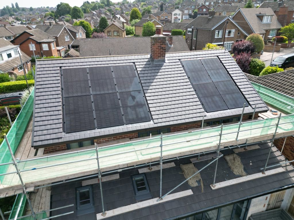 New-build house with all-black solar panels fitted before the scaffolding comes down