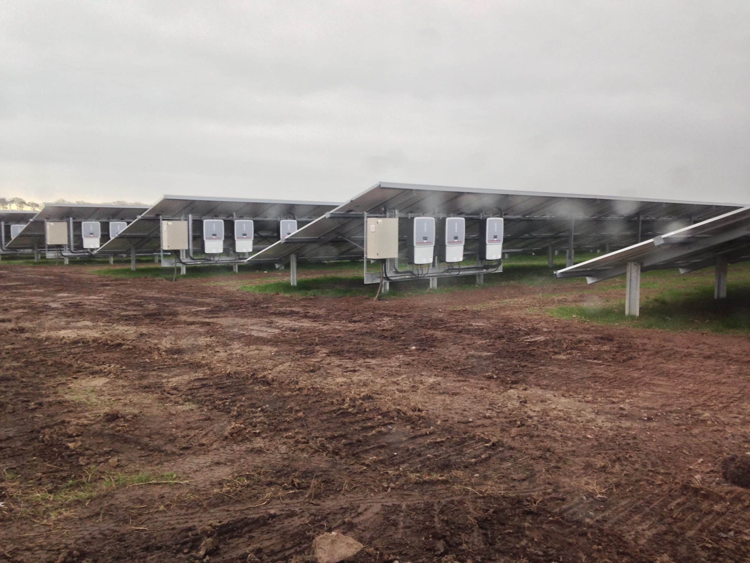 Micro inverters installed beneath solar panels on UK residential roof