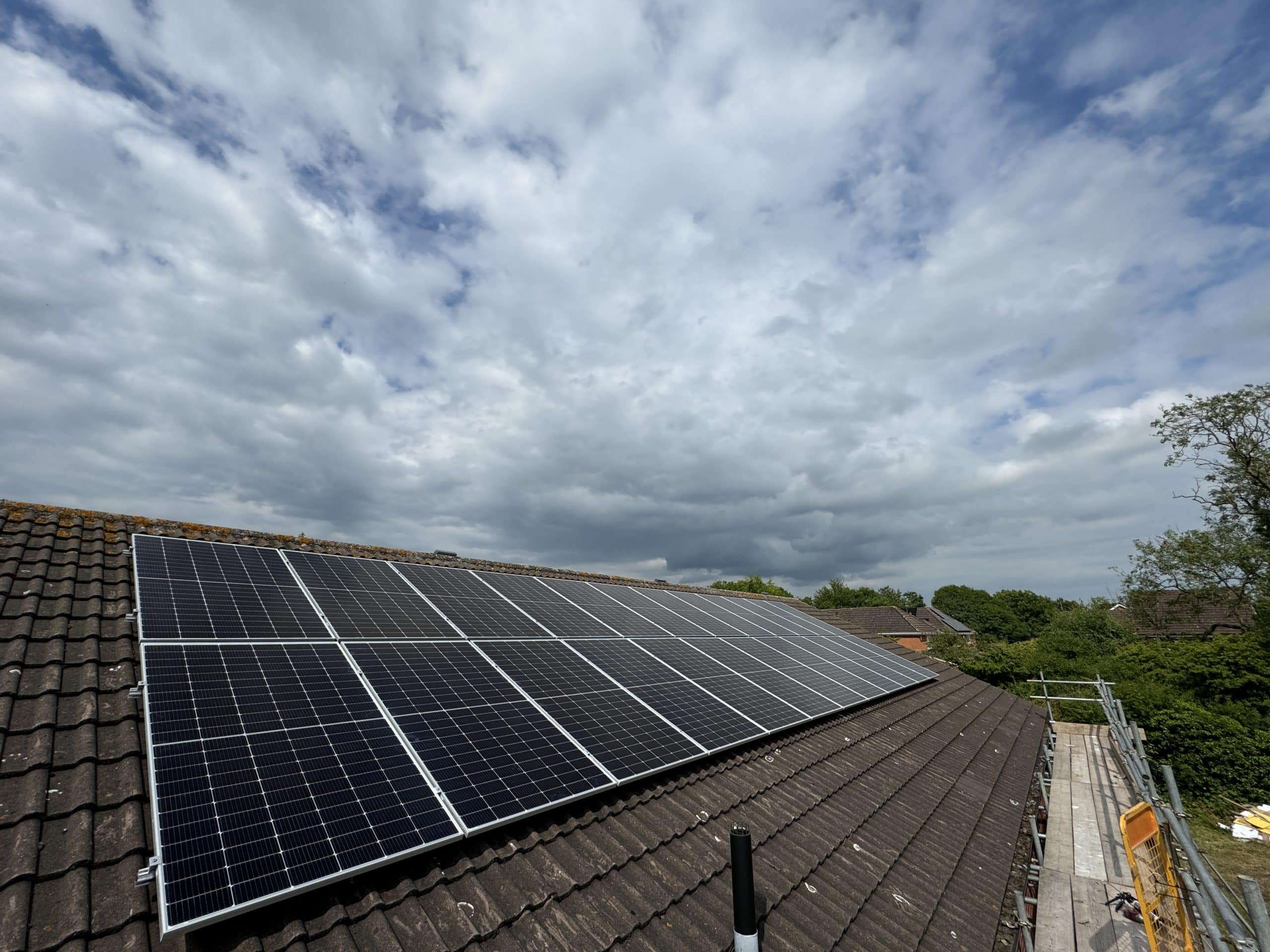 Side by side comparison of monocrystalline and polycrystalline solar panels showing different surface textures and colours