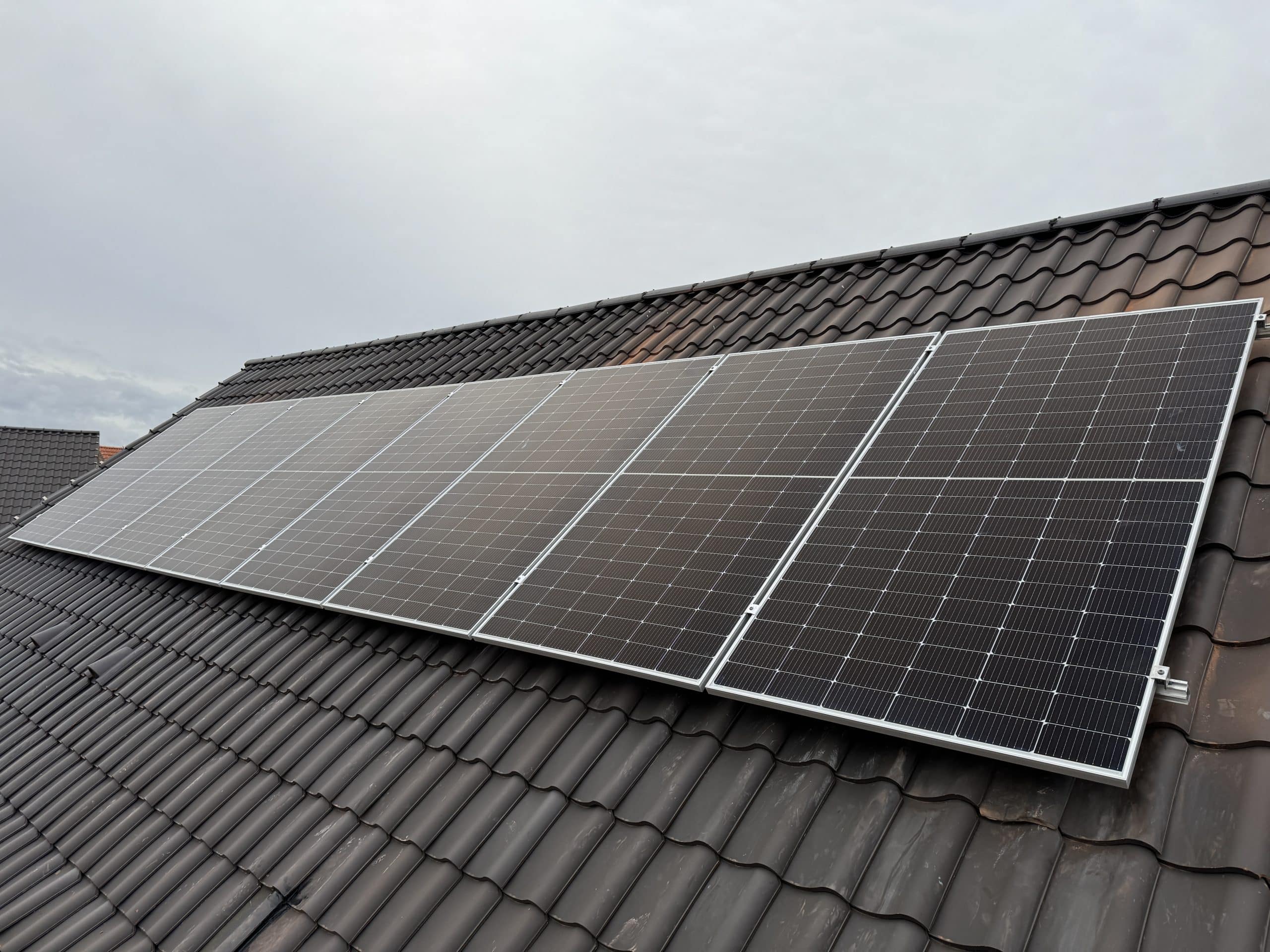 Close-up of monocrystalline solar panel showing uniform black cell structure