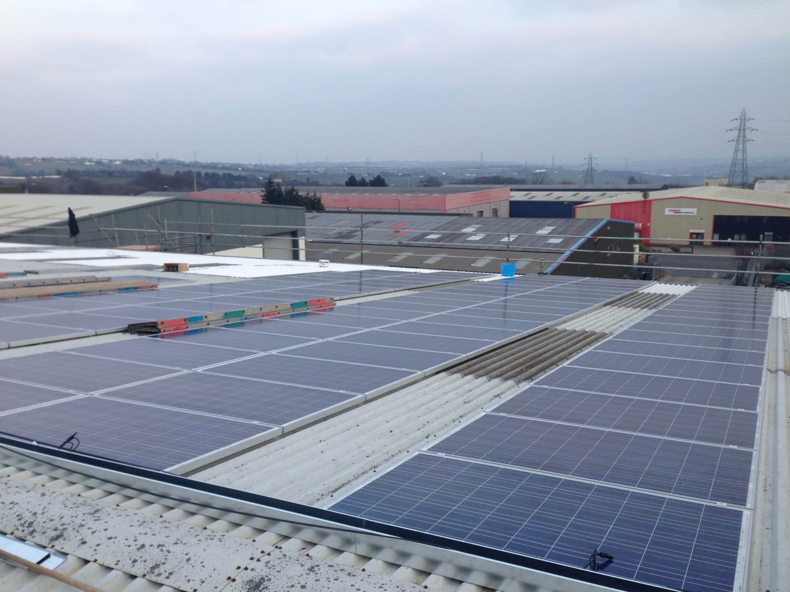 Thin-film solar panel installation on large commercial building roof