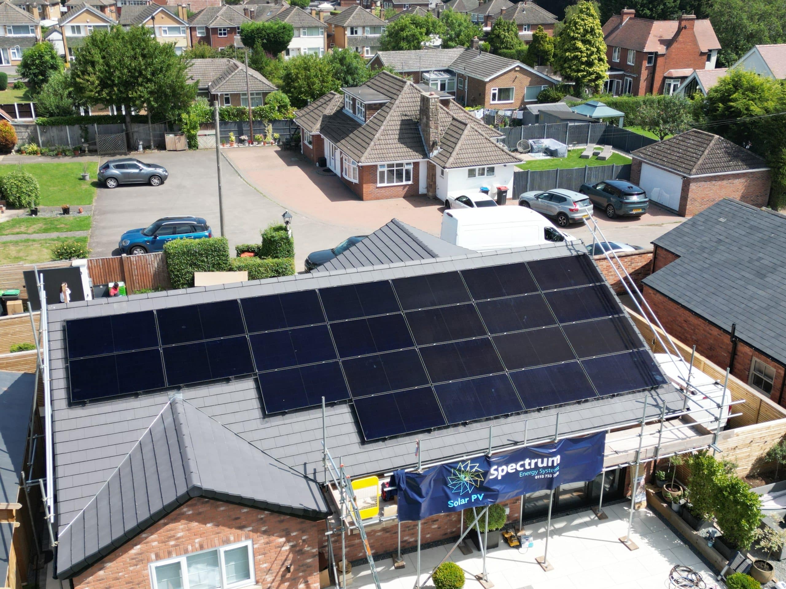 Aerial drone view of completed 24-panel Longi solar array on residential bungalow in Papplewick, Nottingham