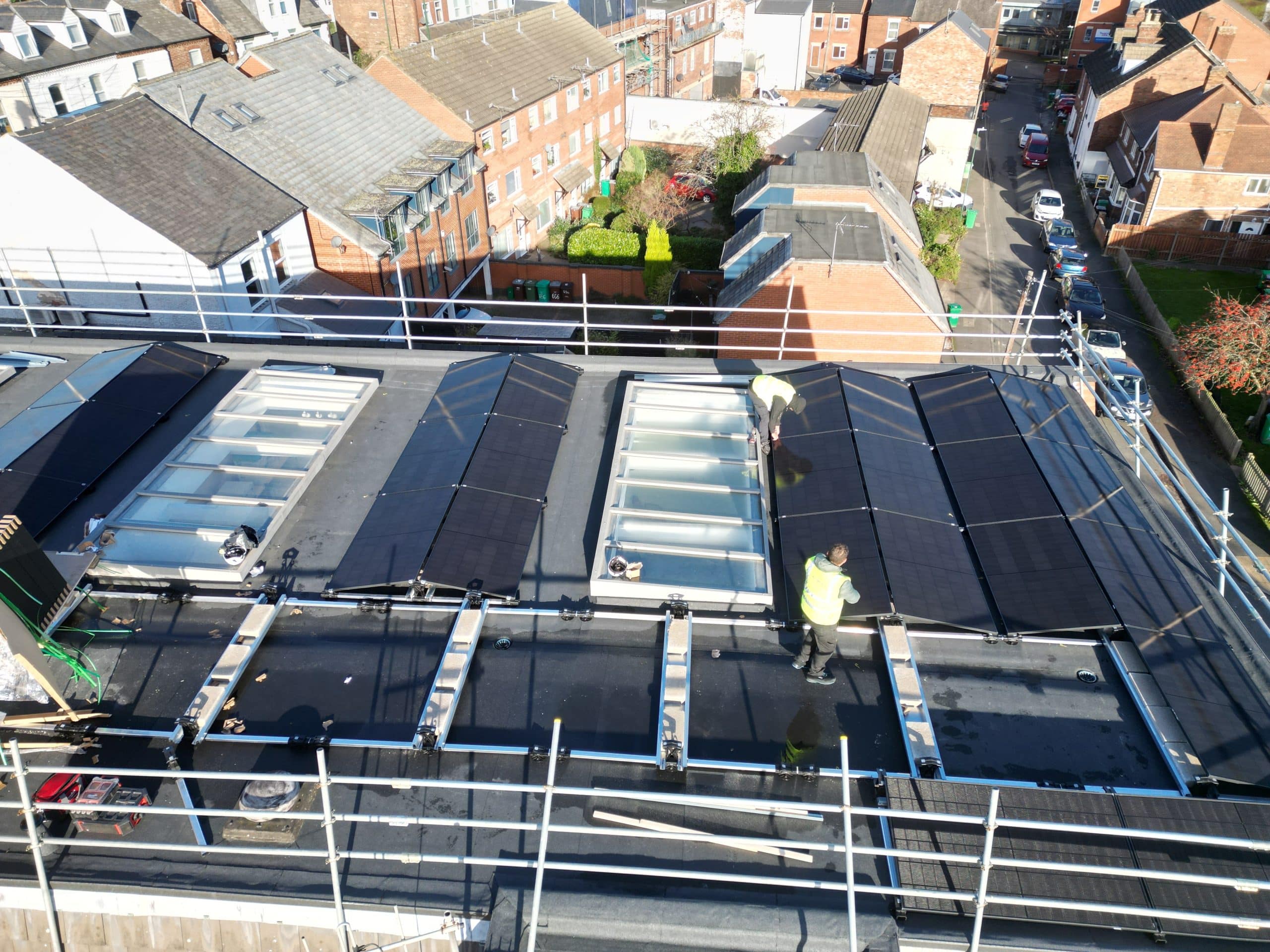 Esdec mounting system with JA Solar 500W panels installed around rooflights on commercial flat roof