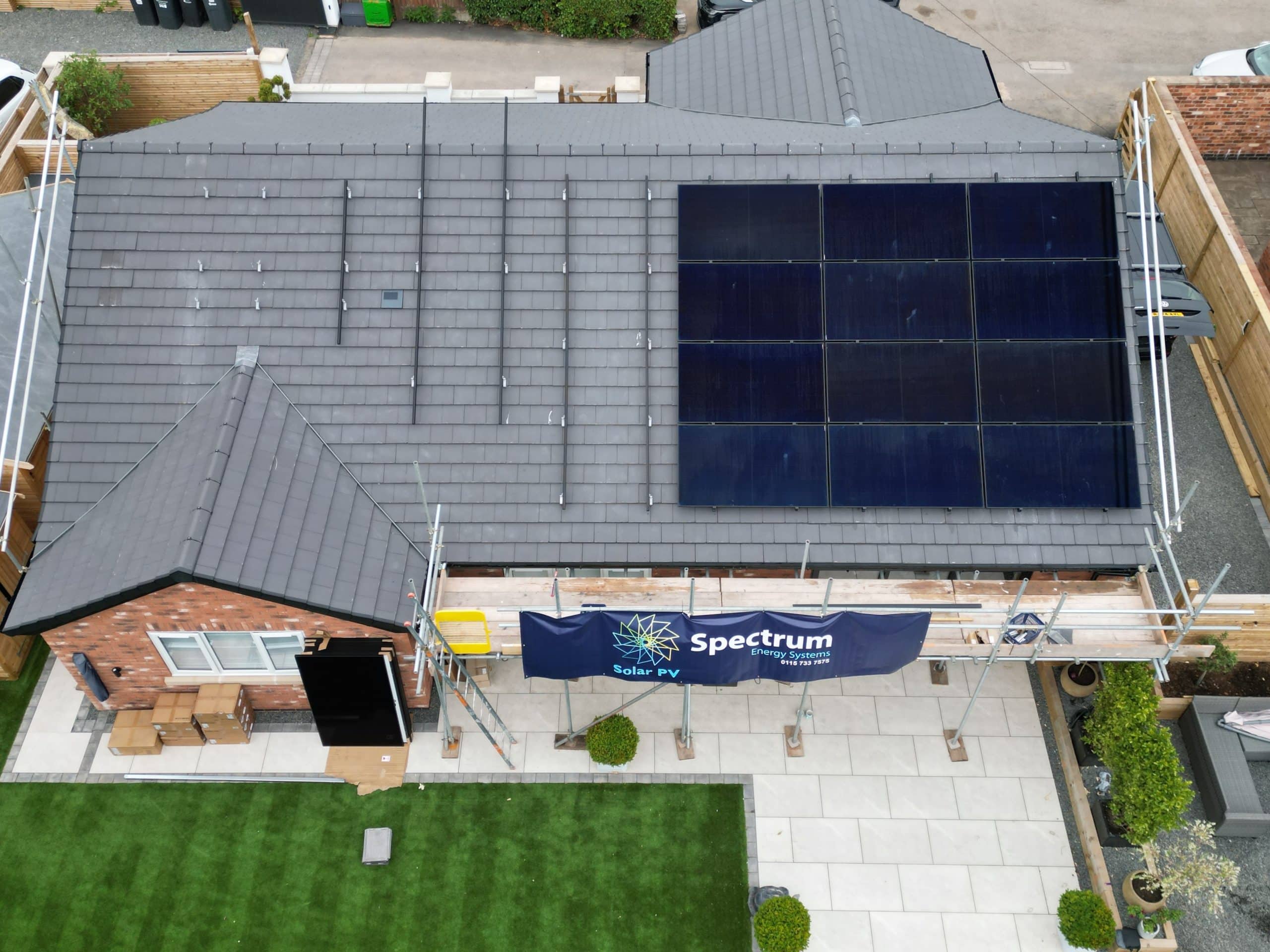 Solar PV installation with scaffolding showing progress on residential bungalow in Papplewick