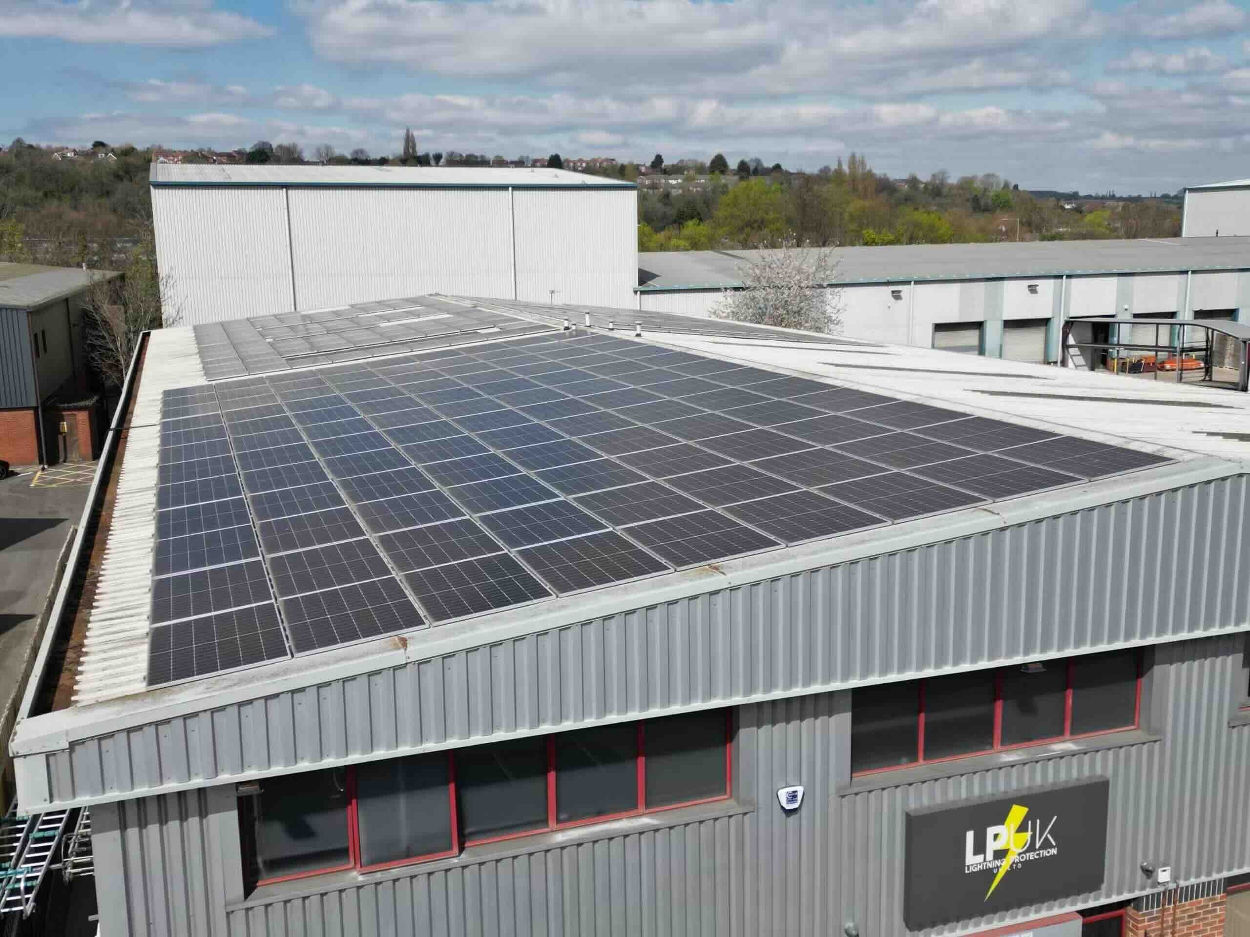 Large-scale commercial solar panel installation on an industrial roof in Bingham
