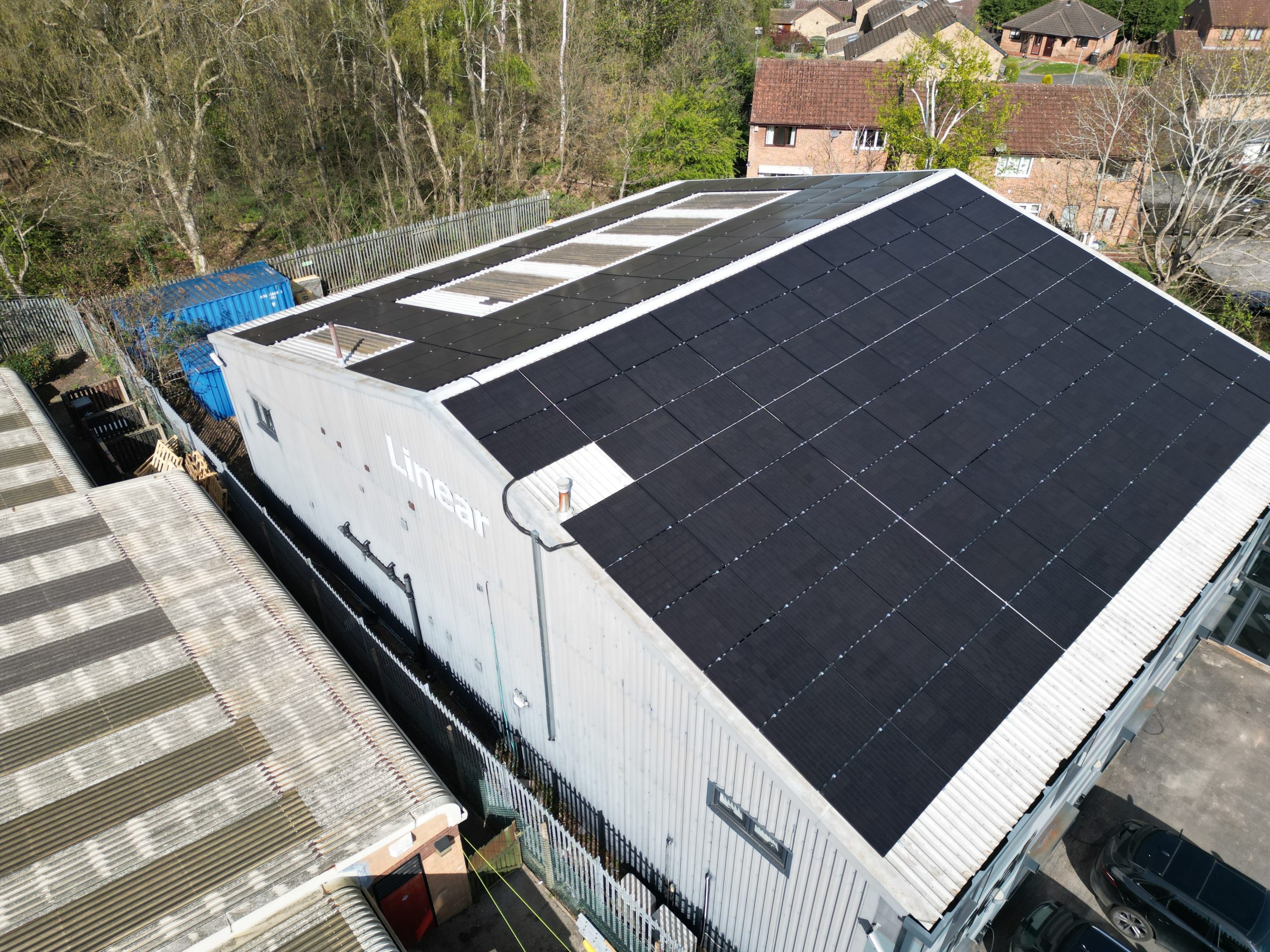 67kW commercial solar panel installation completed on metal portal frame roof at Linear Insulation, Nottingham - aerial view showing full array configuration