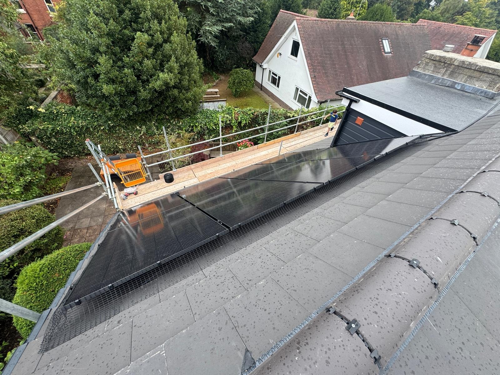 Completed 7.2kW JA Solar all-black panel array by dormer window at Sherwood residential property