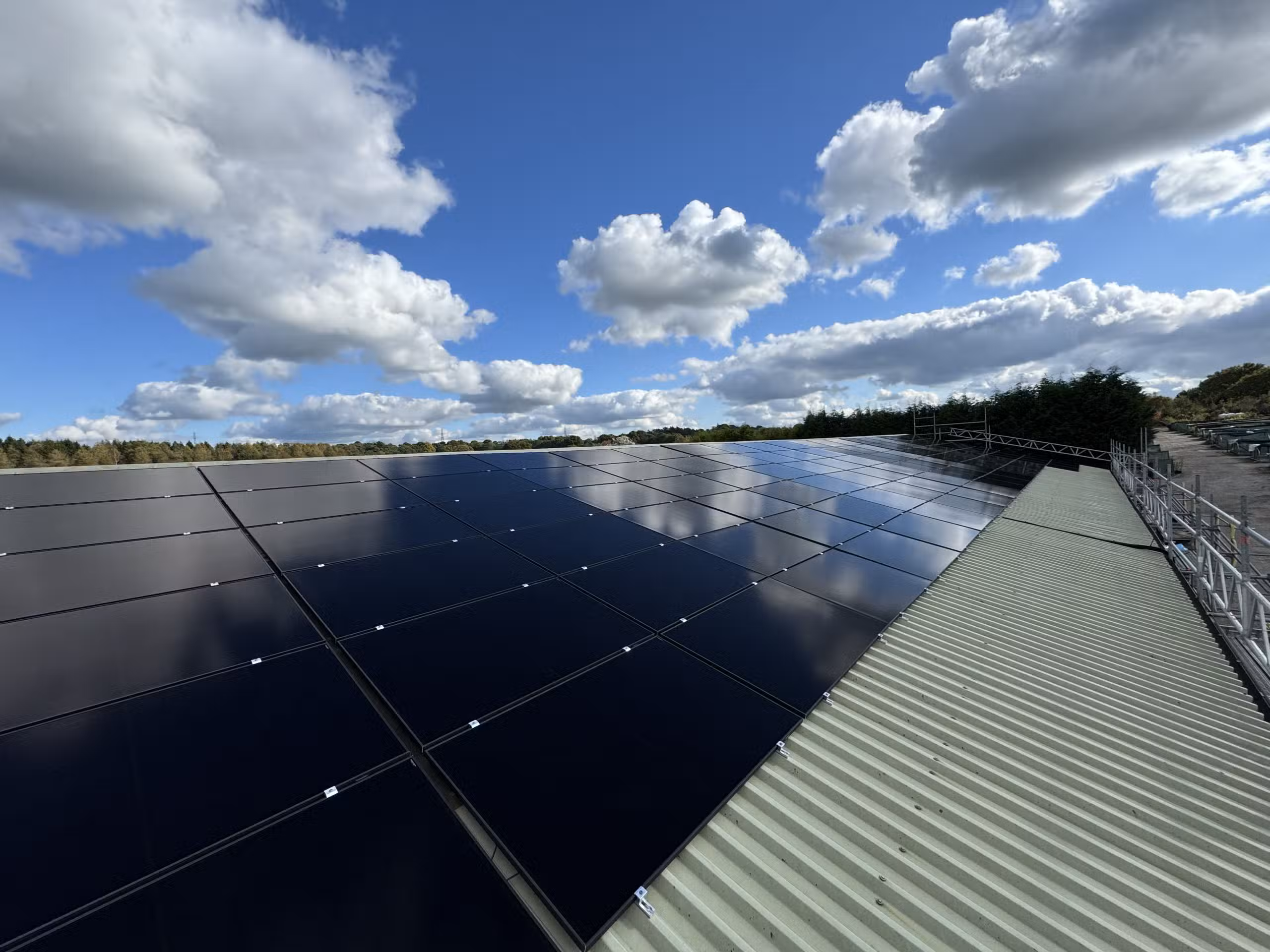 Commercial solar panels installed on UK warehouse roof delivering strong ROI