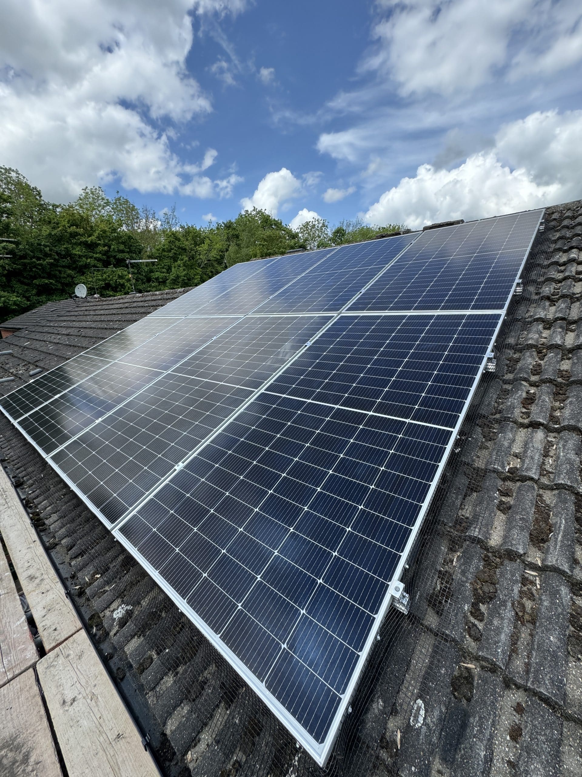 Solar panels covered in light snow UK winter