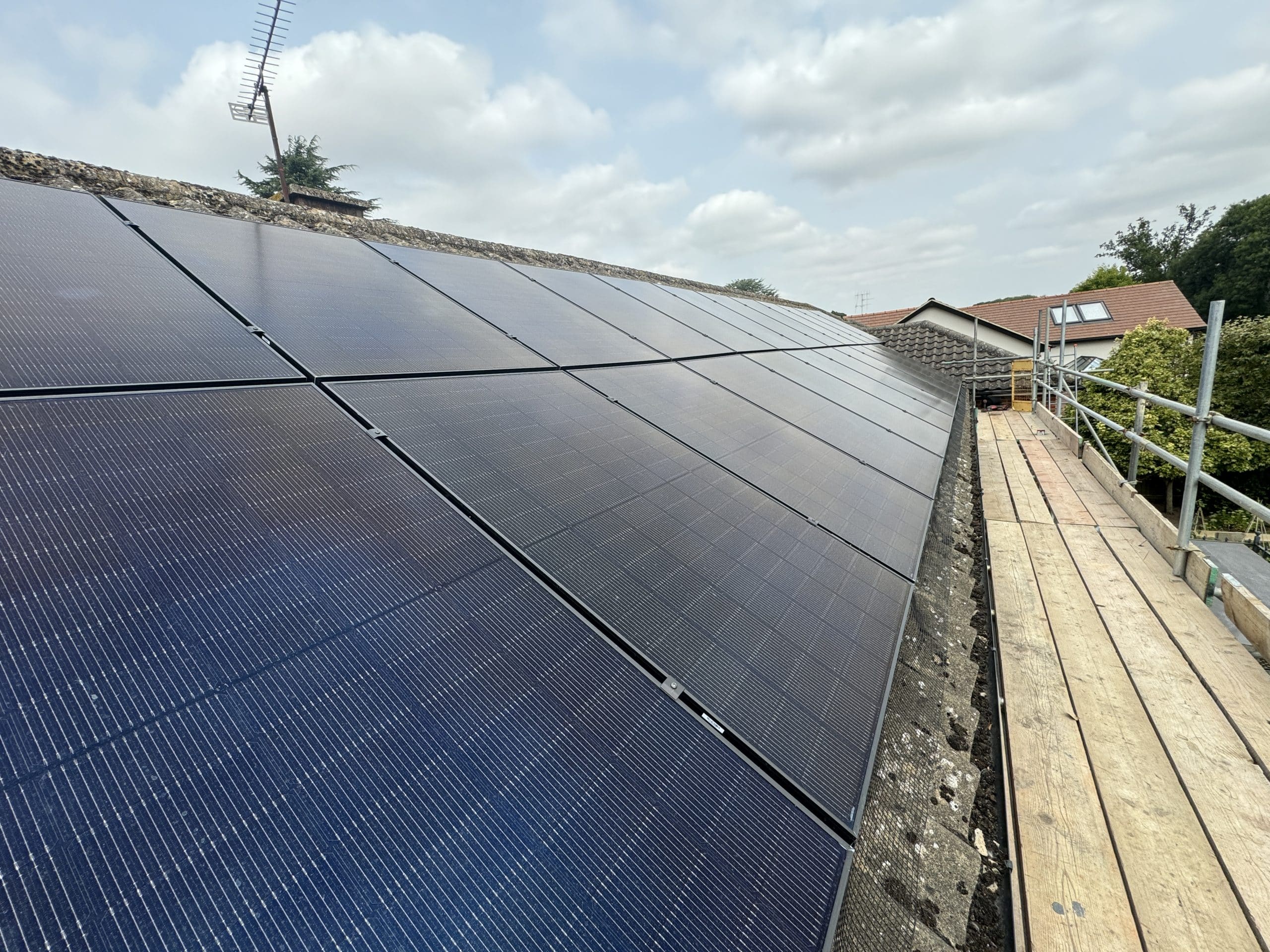 Monthly electric bill comparison showing savings with solar panels versus without