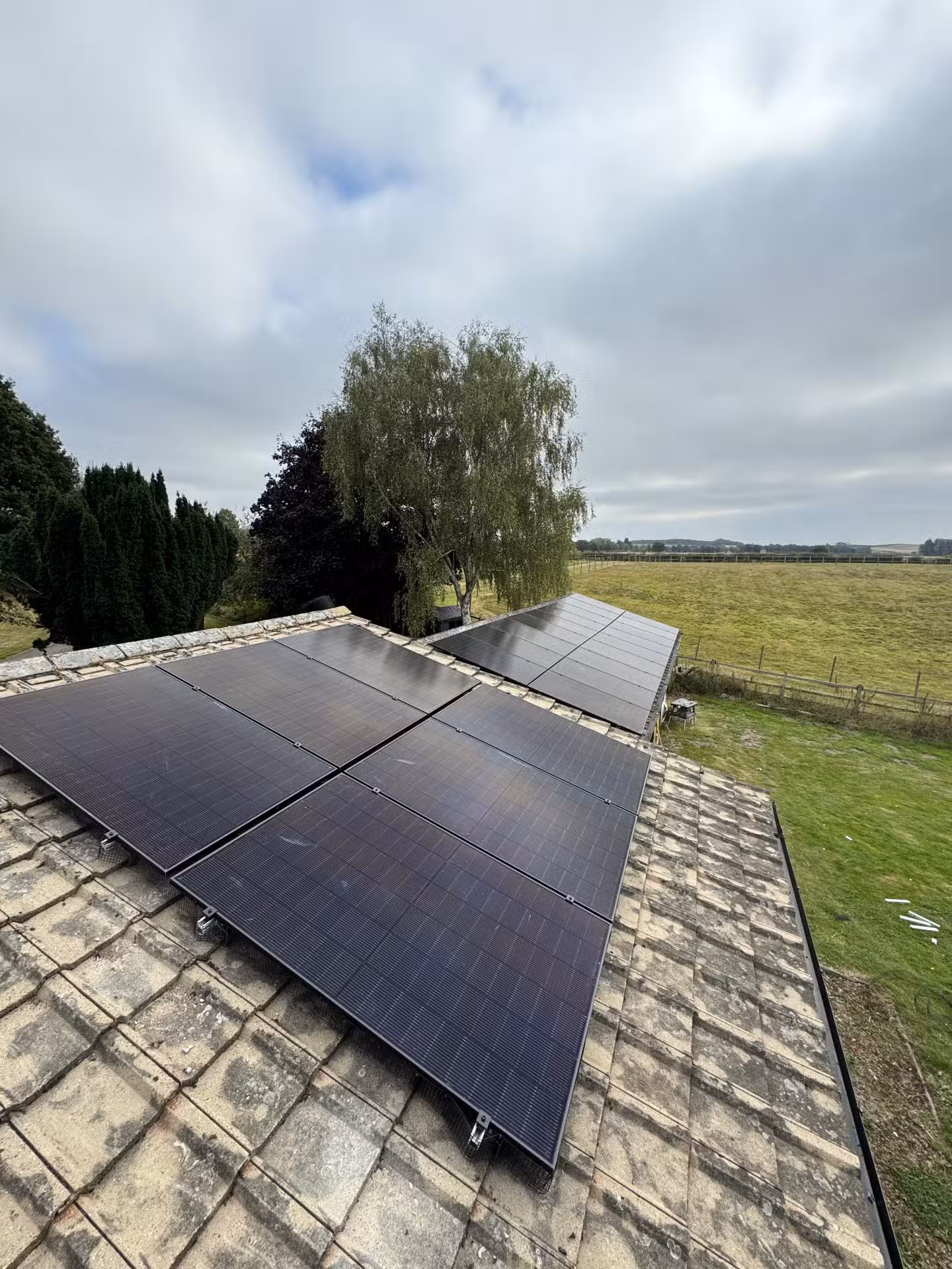 Ground solar panel array with optimal south-facing orientation in UK property