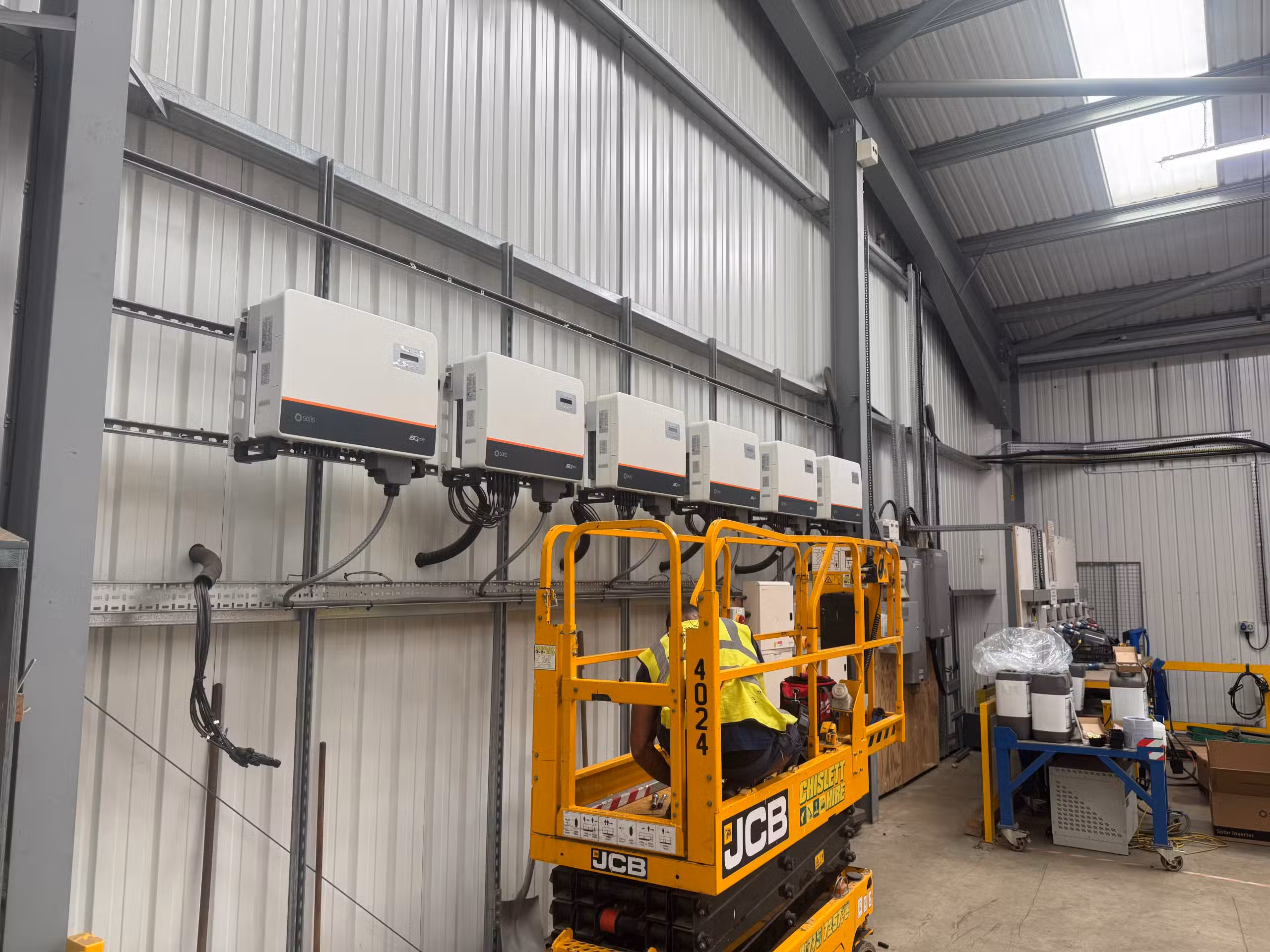 Solis 25kW string inverters being installed in warehouse electrical room at Elsoms Seeds commercial solar inverter replacement project