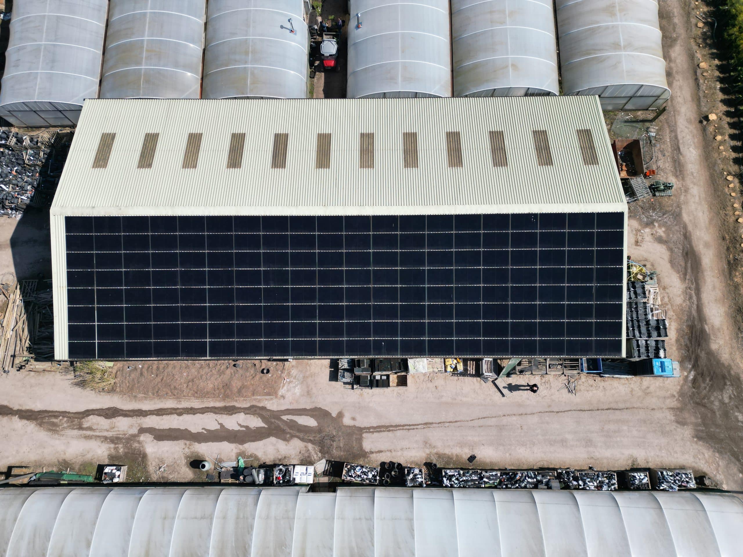 Smart solar inverter and battery storage system with automated energy management display showing power flow UK home