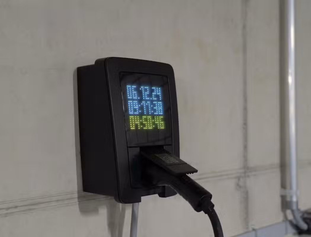 Electric car charging at home wallbox charger in UK driveway