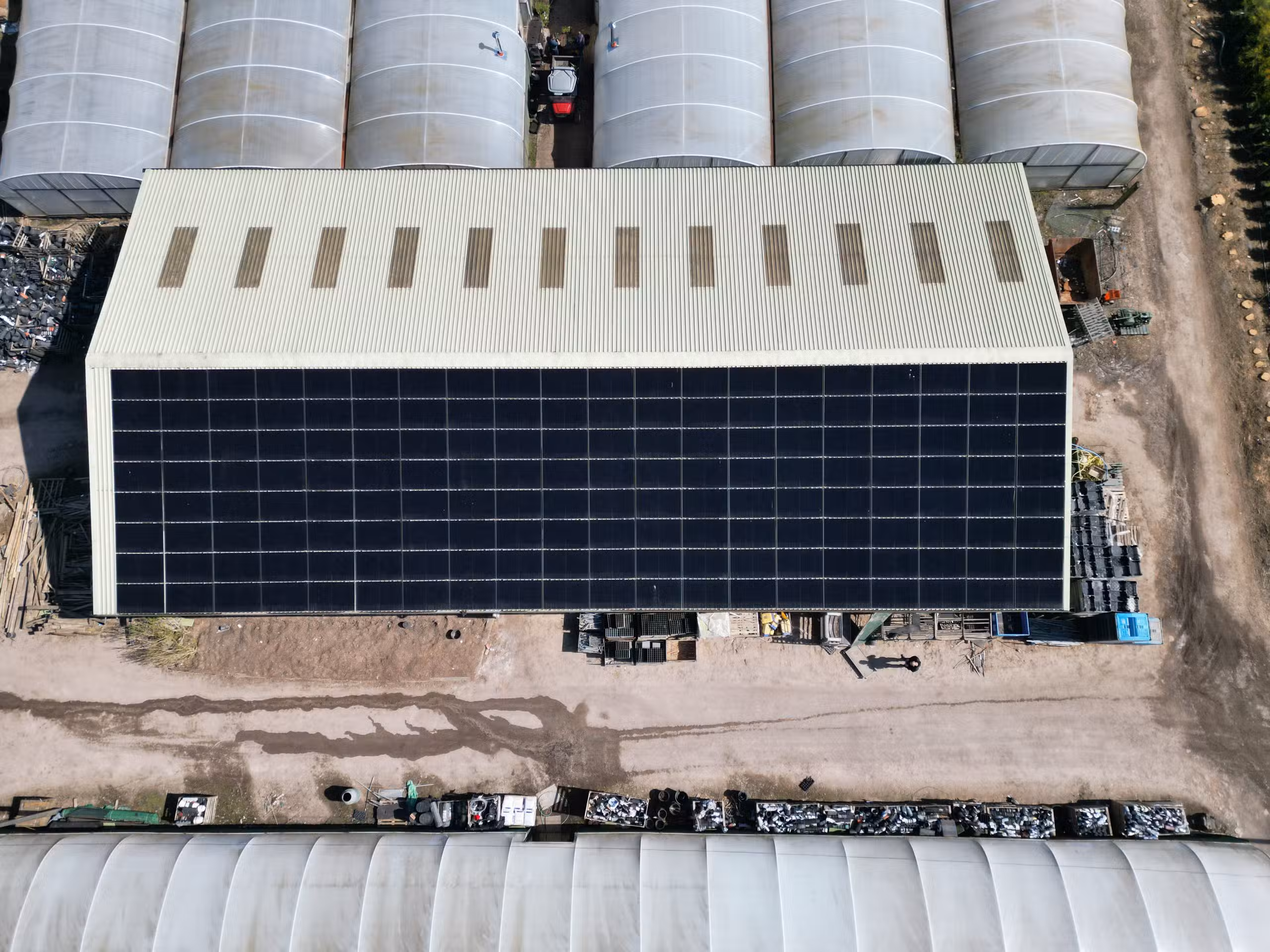 Flexible thin-film portable solar panels being stored in a campervan showing their lightweight compact design