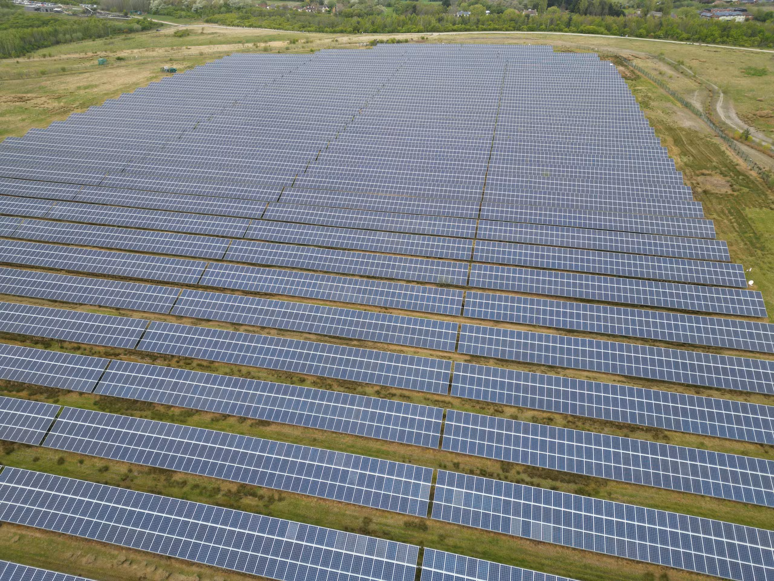 Flexible marine solar panel being installed on a boat bimini top demonstrating curved surface mounting capability