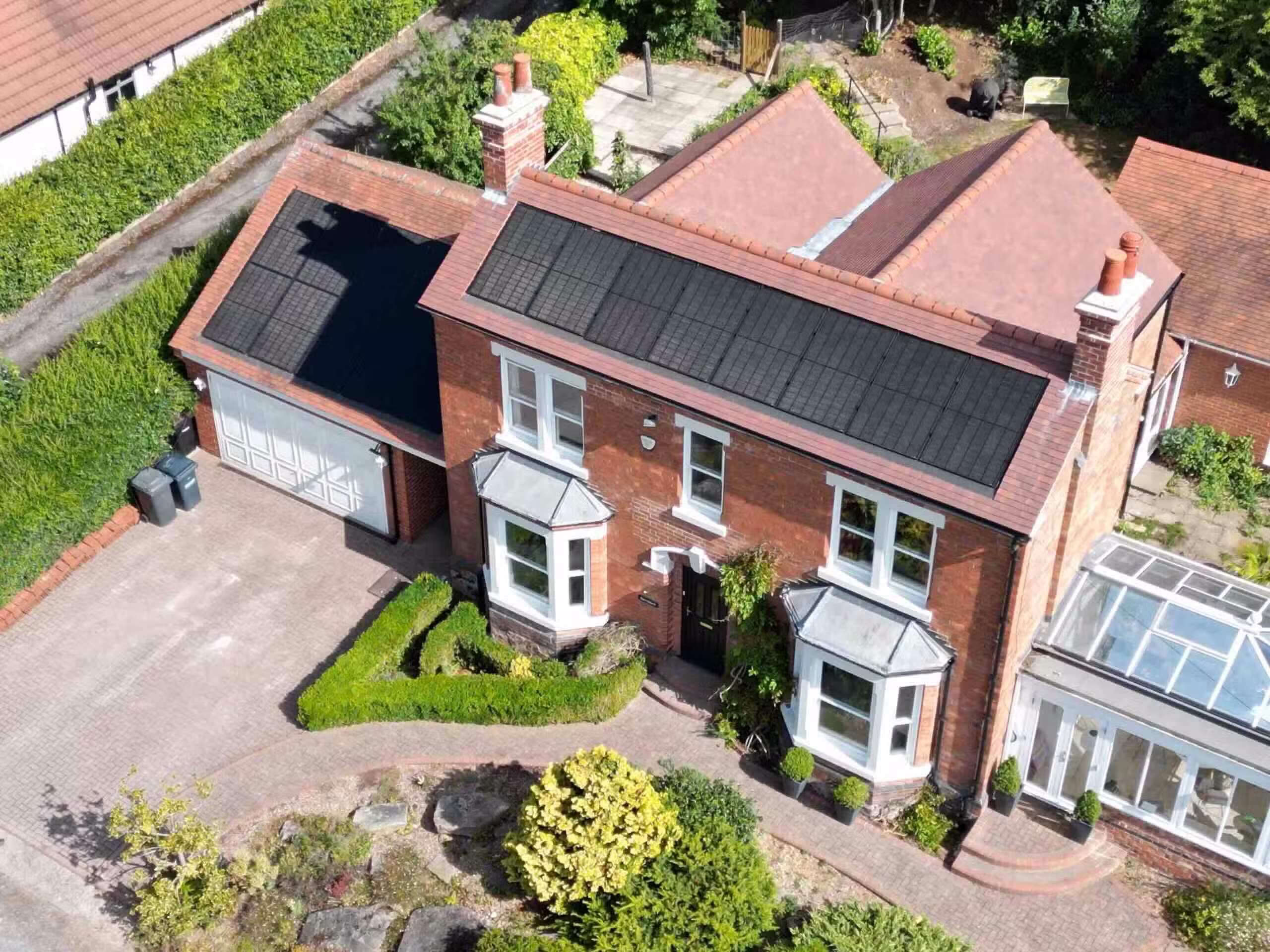Spectrum installers fitting rooftop solar panels on a property in Spilsby