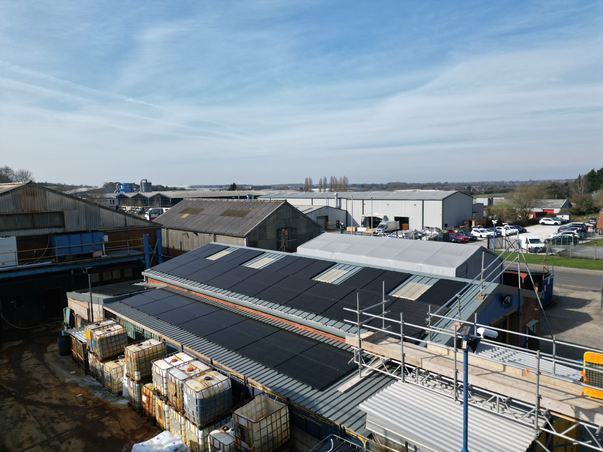 Drone view of the 24kW all-black solar panel array on the metal workshop roof at Keyte Smith, Kirkby-in-Ashfield