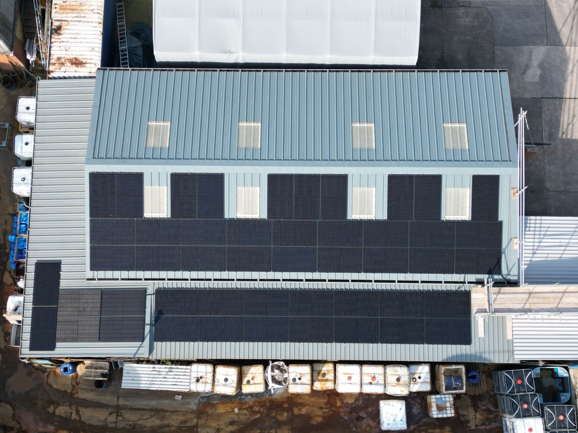 Top-down aerial view of the 24kW solar panel array on the metal workshop roof at Keyte Smith, Kirkby-in-Ashfield