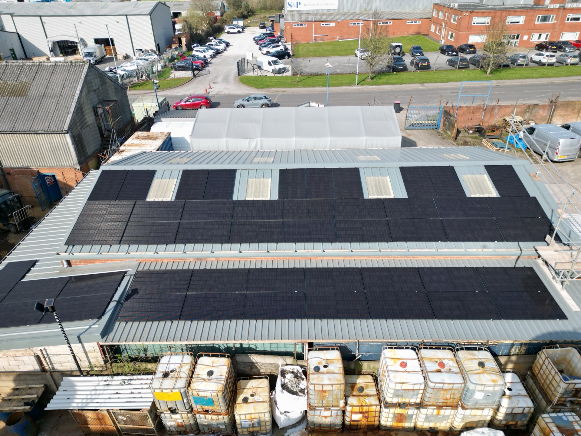 48 all-black 500W solar panels arranged around skylights on the workshop metal roof at Keyte Smith in Kirkby-in-Ashfield