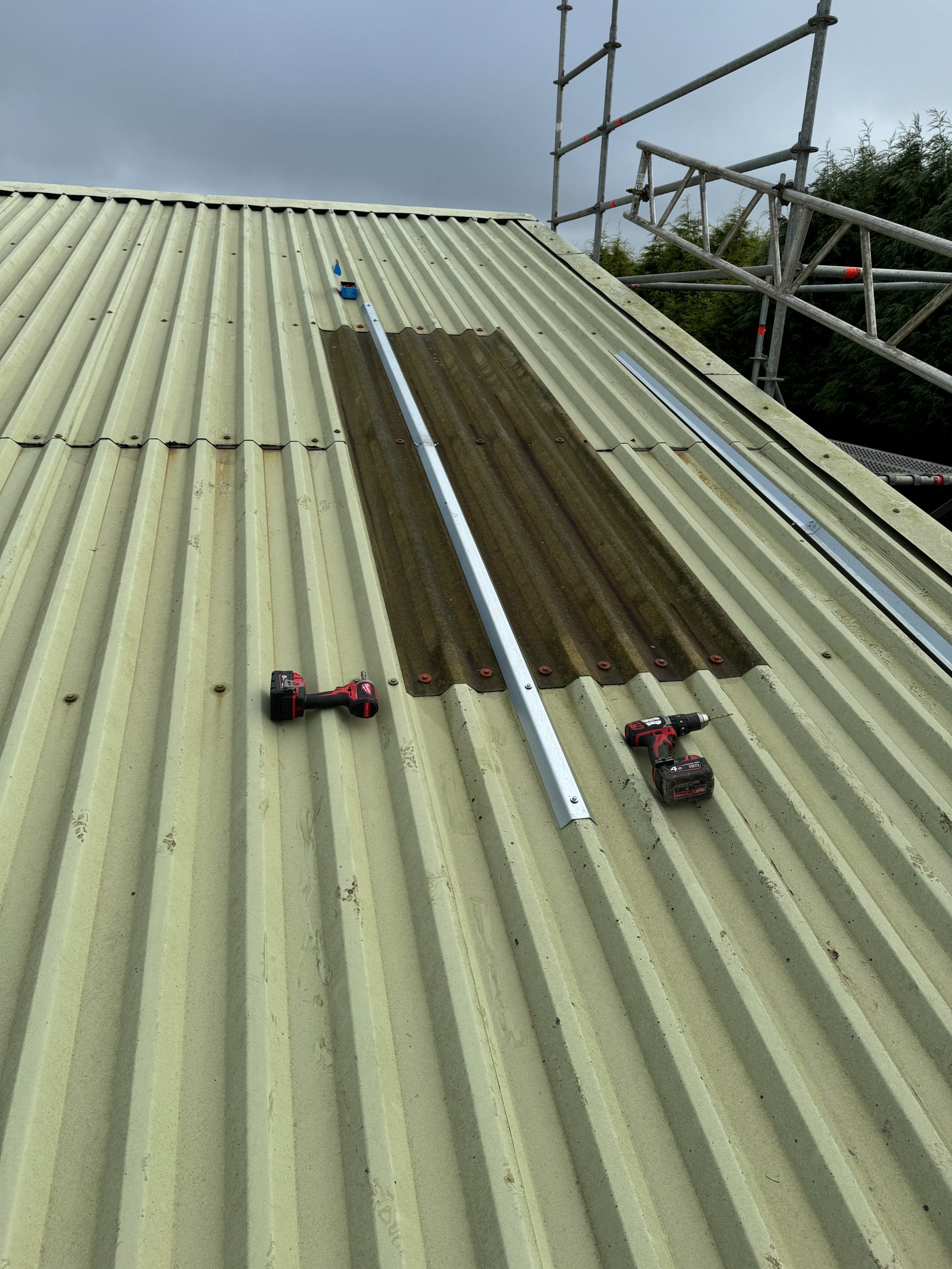 Renusol MetaSole mounting rails fixed to a trapezoidal metal farm building roof during an agricultural solar panel install (Spectrum Energy Systems)