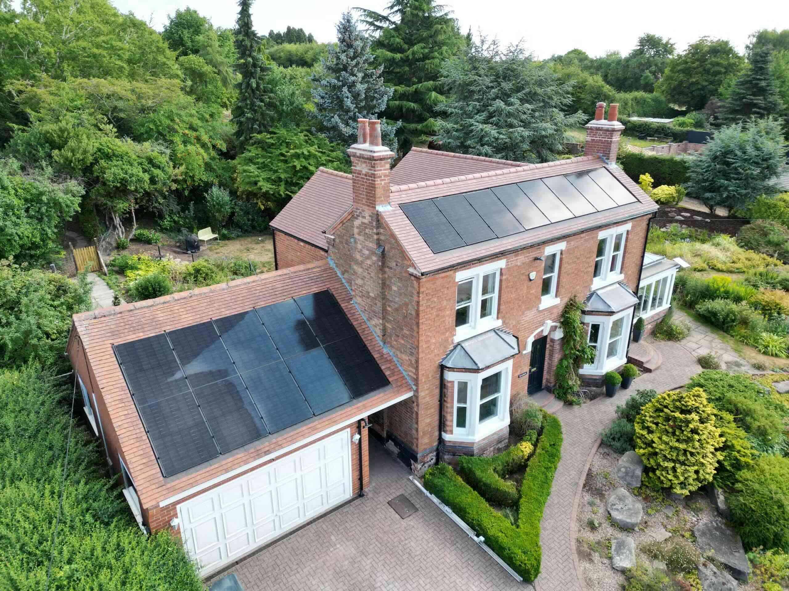 Downside of solar panels answered on aesthetics, all-black panel arrays on a Kimberley NG16 home and garage roof (Spectrum Energy Systems UK installation)