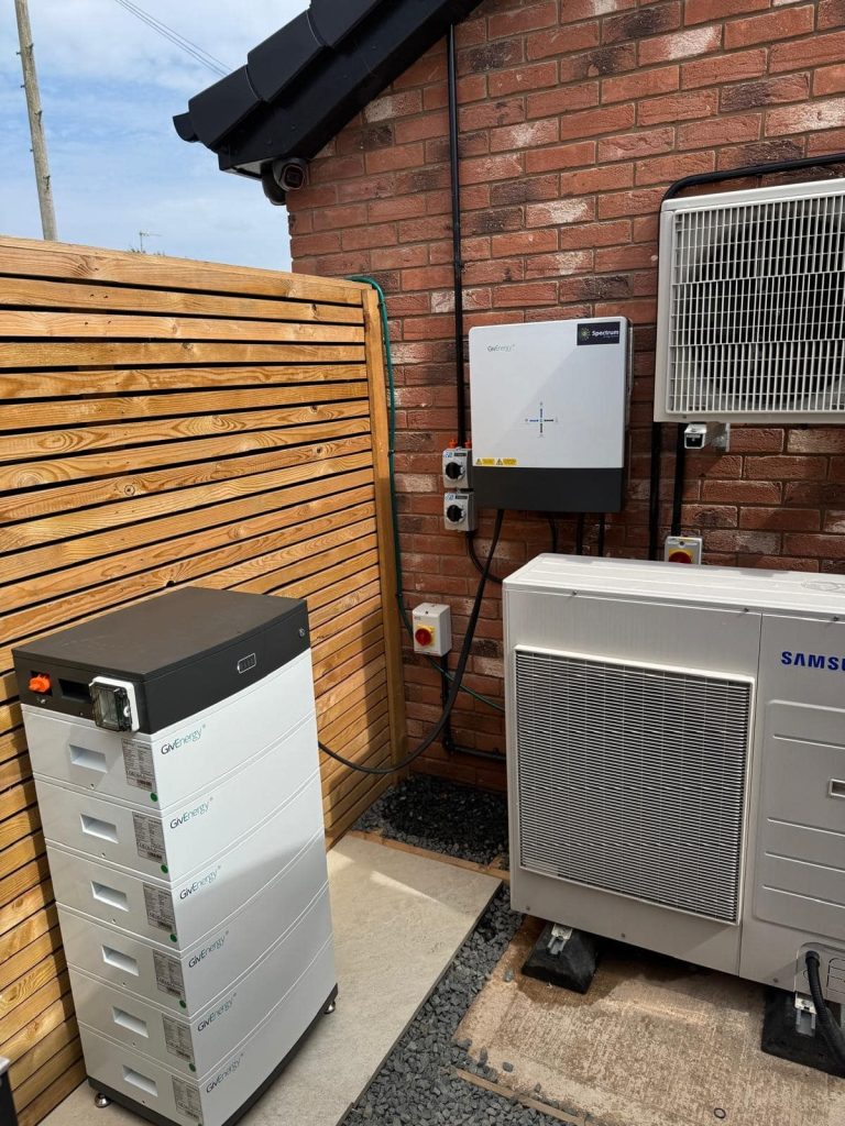 Home solar battery storage - battery stack and hybrid inverter installed with an air source heat pump by Spectrum