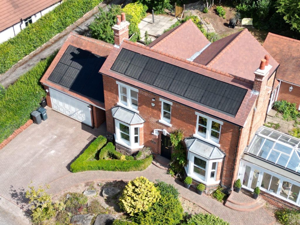 Roof suitability for solar panels - drone view of in-roof arrays on house and garage, Woodborough, Nottingham